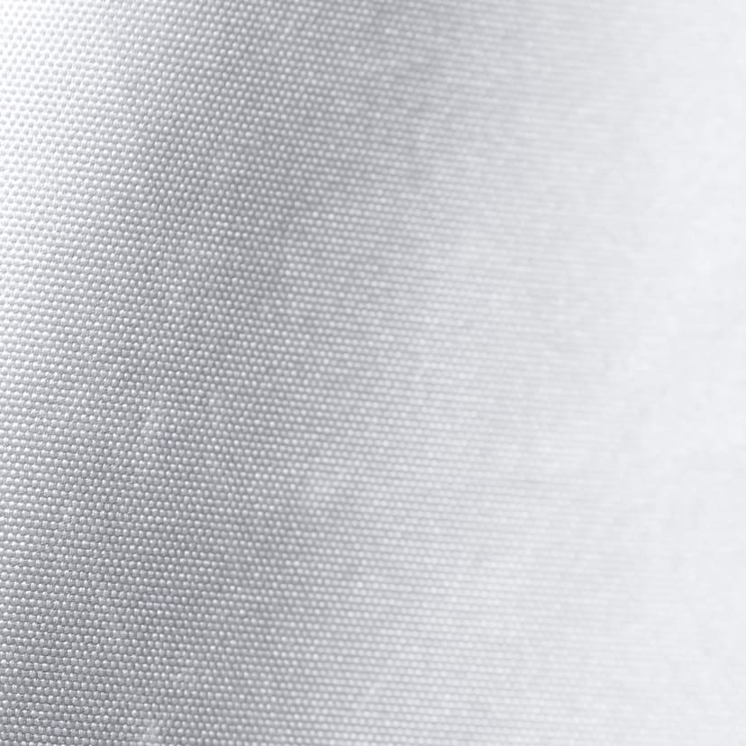 Close up of the silver polyester weave of a cover's outer shell.