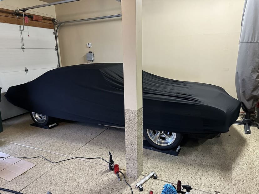 Aaron E.'s vehicle under its cover, from their review.