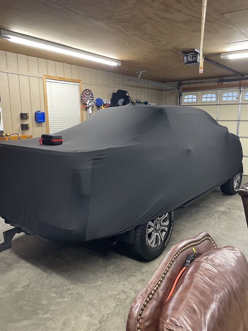 Paul P.'s vehicle under its cover, from their review.