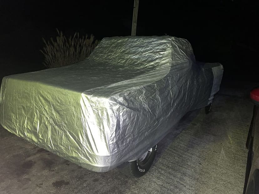 Platinum cover on a classic Chevy C10 pickup at night