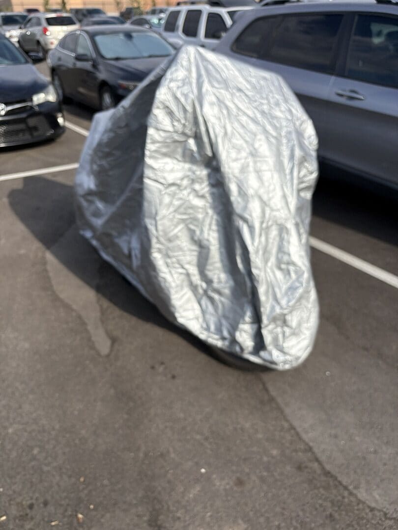 Chad's vehicle under its cover, from their review.