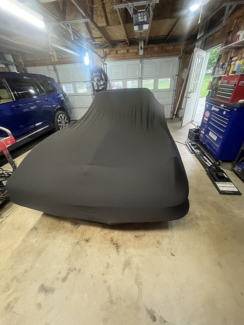 Michael N.'s vehicle under its cover, from their review.