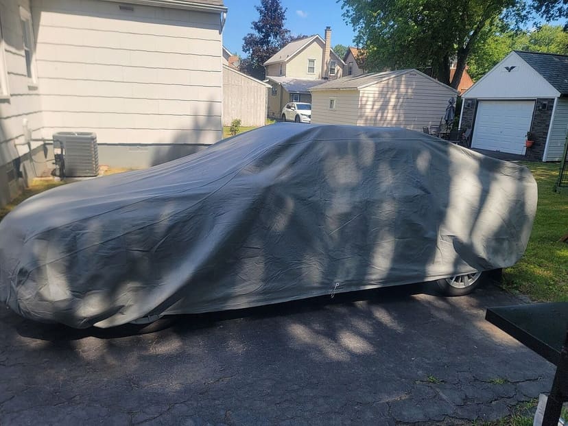 Justin E.'s vehicle under its cover, from their review.
