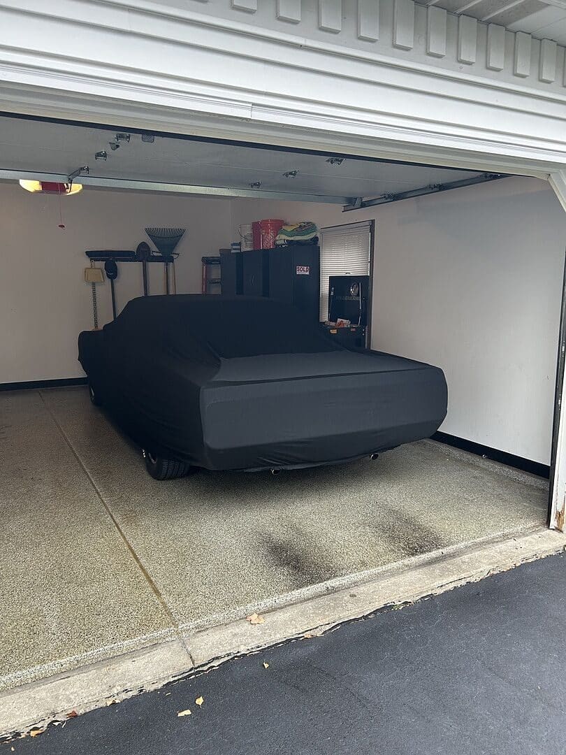 Gregory U.'s vehicle under its cover, from their review.