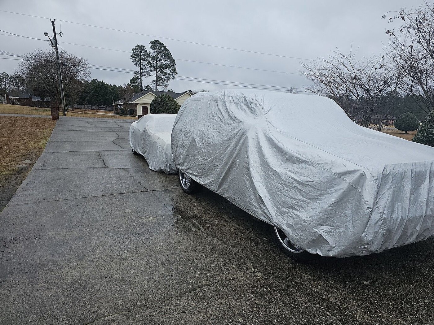 A customer's car under its CarCovers cover