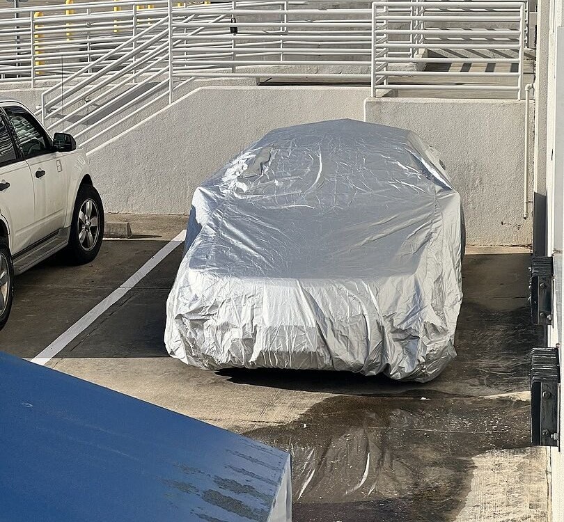 A customer's car under its CarCovers cover