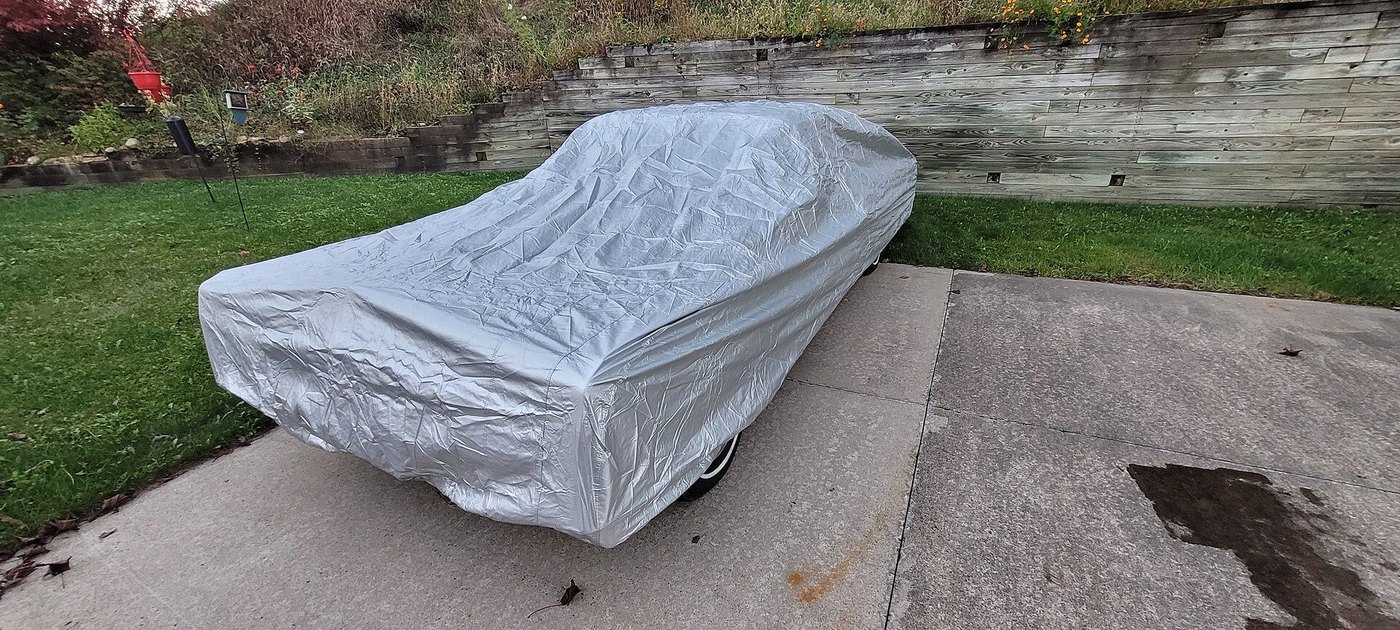 A customer's car under its CarCovers cover