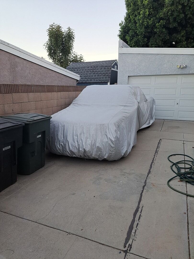 A customer's car under its CarCovers cover