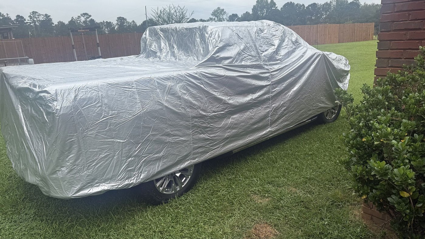 A customer's truck under its CarCovers cover